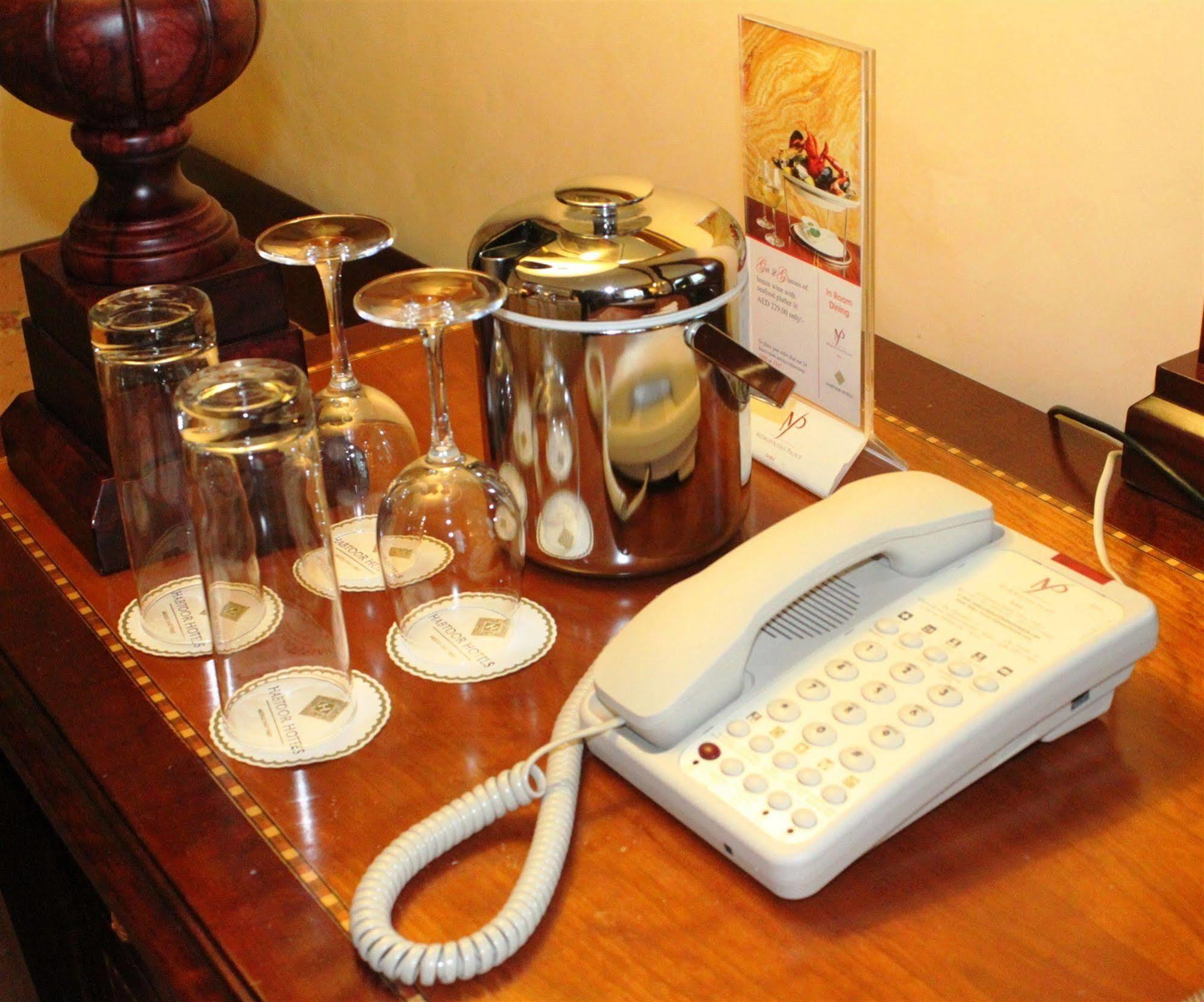 Knight Castle Hotel Dubai Exteriör bild A telephone in a hotel room